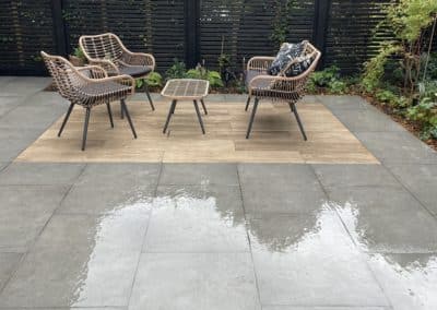 The porcelain planks define the second seating area.