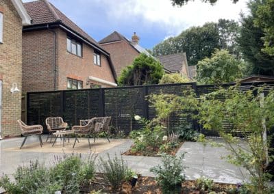 Jackons fencing painted black creates a lovely backdrop for the planting.