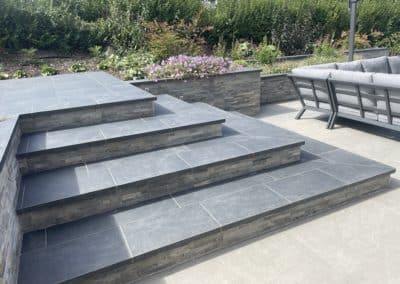 Multi-directional steps with porcelain treads from Global stone and risers cladding from London Stone